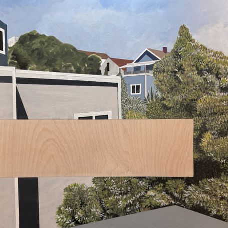 View of residential buildings and trees with a void in the middle.
