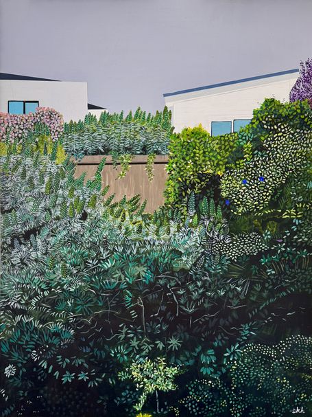 Two houses atop steep yard with echium